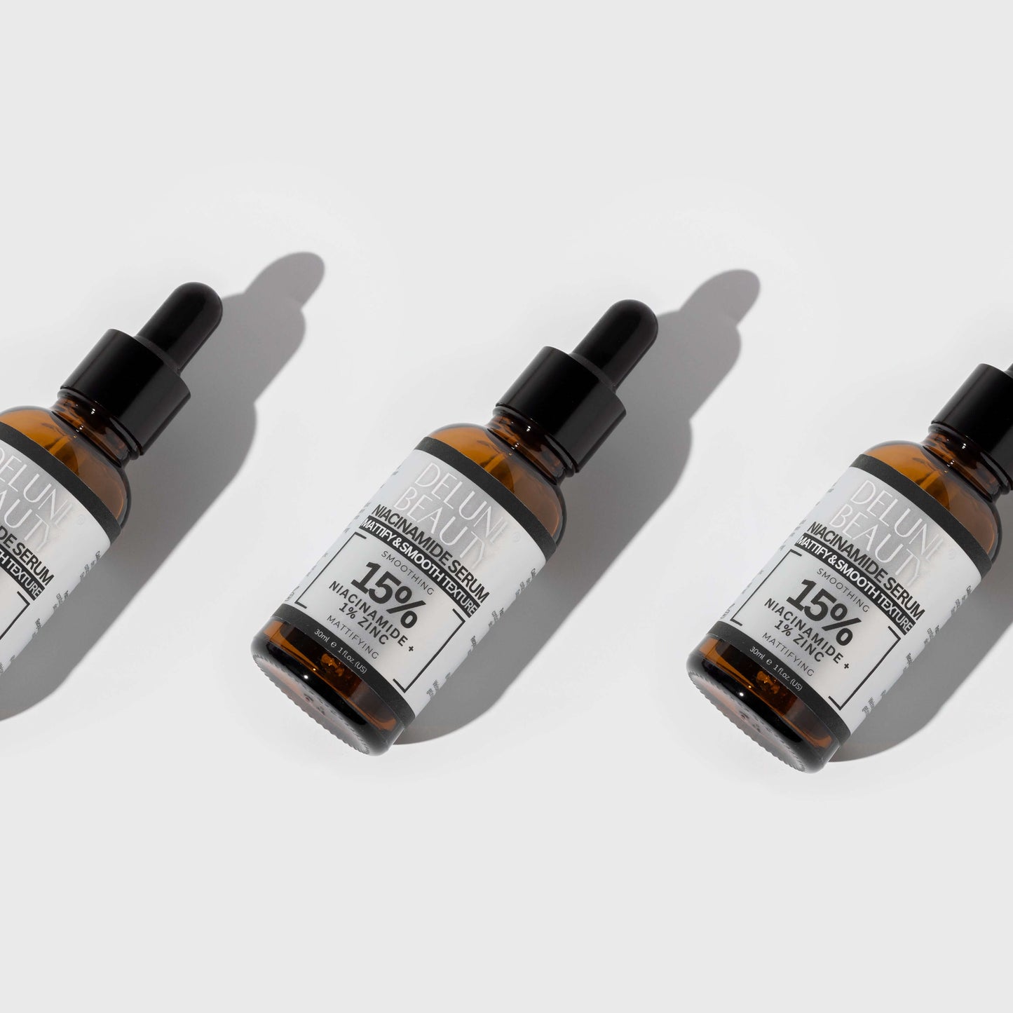 Delune's Niacinamide and 1% Zinc Serum bottles for blemish-free, balanced skin.