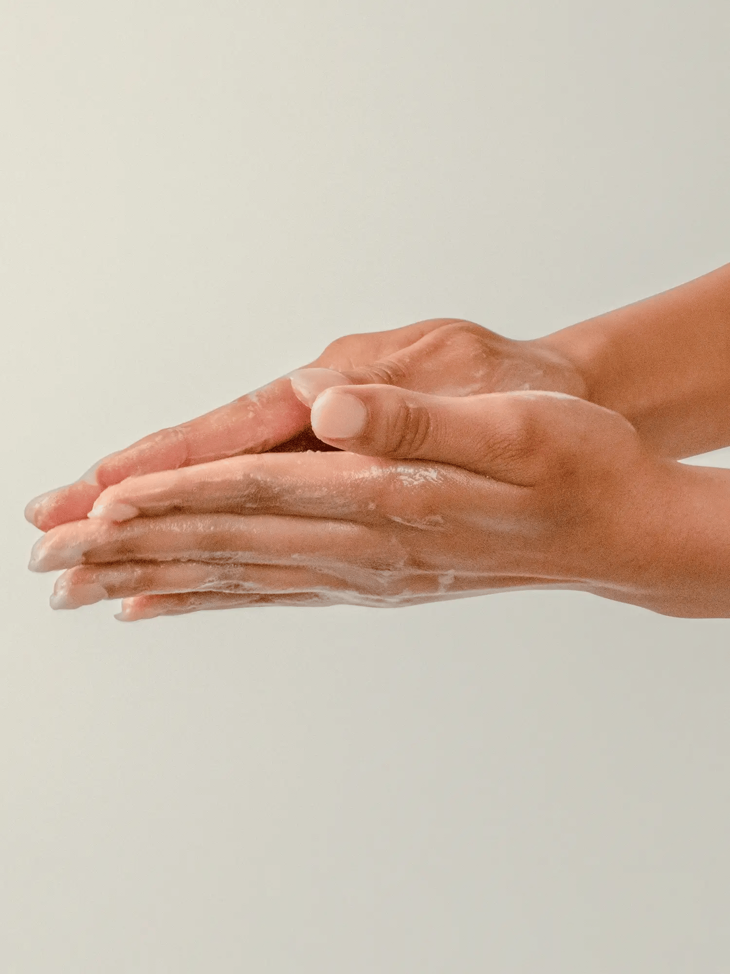 Hands lathering with eco-friendly soap, demonstrating sustainable formula for clean, soft hands using minimal water.