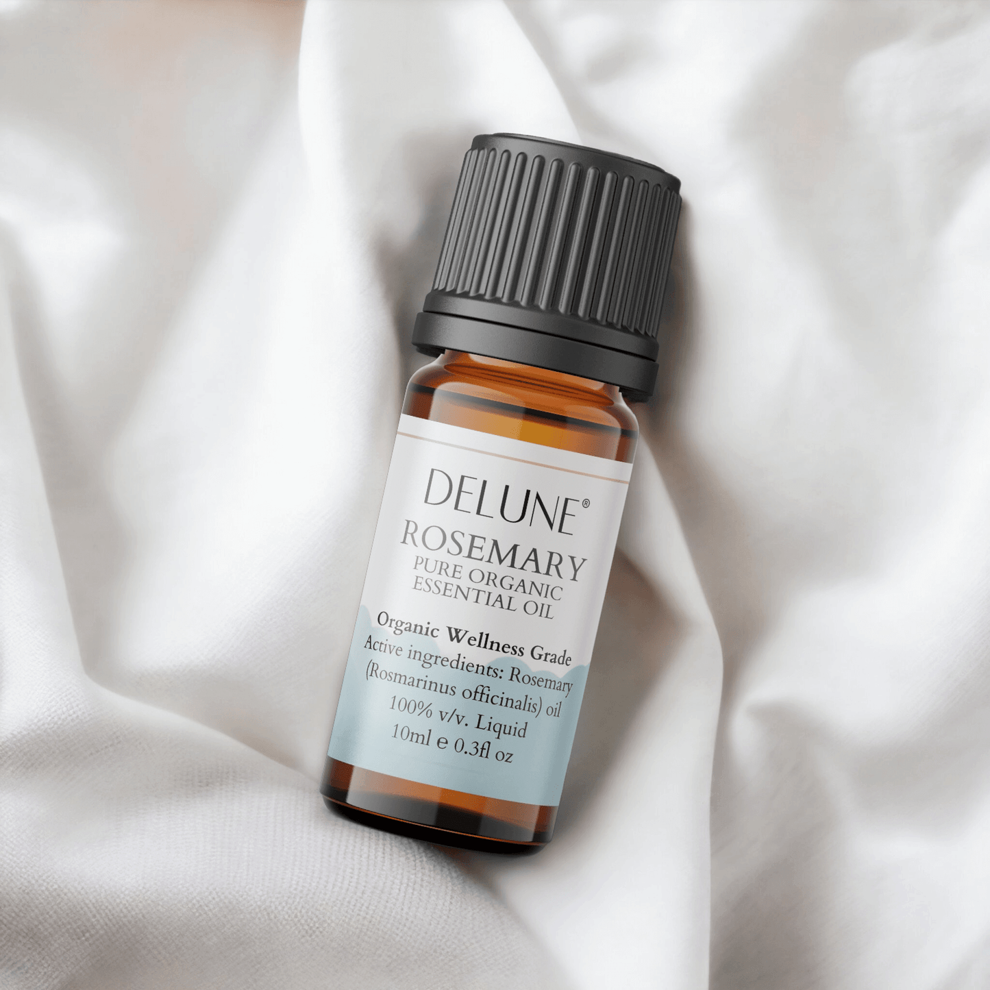 Rosemary Organic Wellness Grade Essential Oil on a soft white background. 100% Rosmarinus officinalis for rejuvenation and clarity.