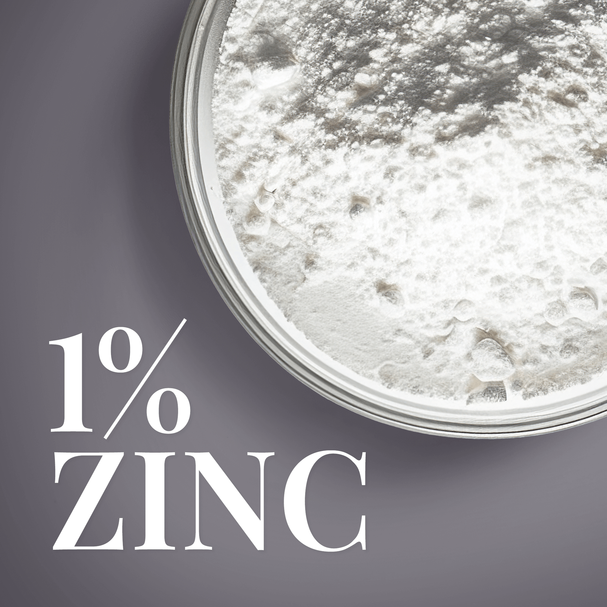 Close-up of 1% zinc powder texture in a glass dish, promoting skincare benefits.