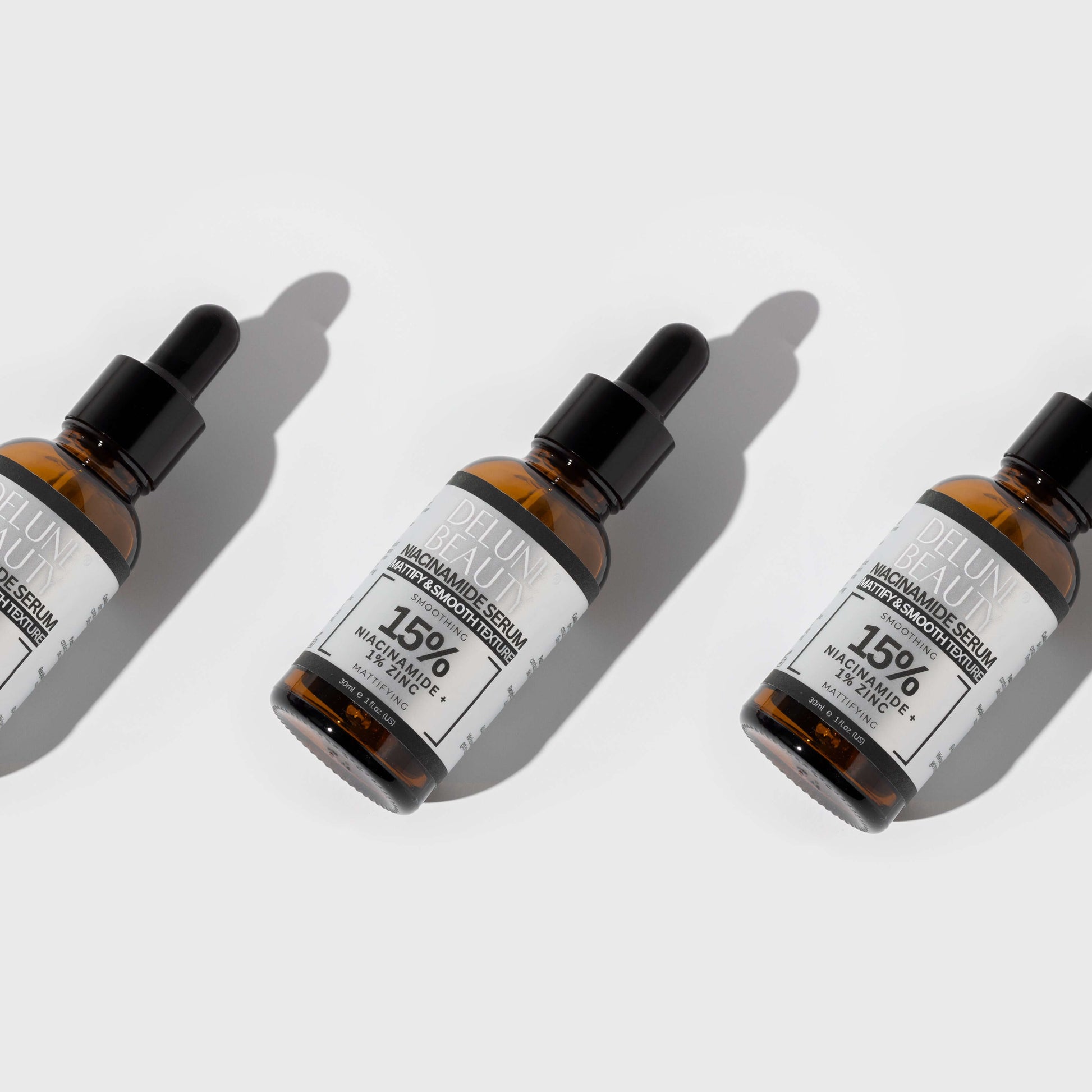 Delune's Niacinamide and 1% Zinc Serum bottles for blemish-free, balanced skin.