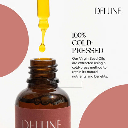 Delune Virgin Raspberry Seed Oil dripping from dropper, highlighting its cold-pressed purity and nutrient-rich hydration benefits.
