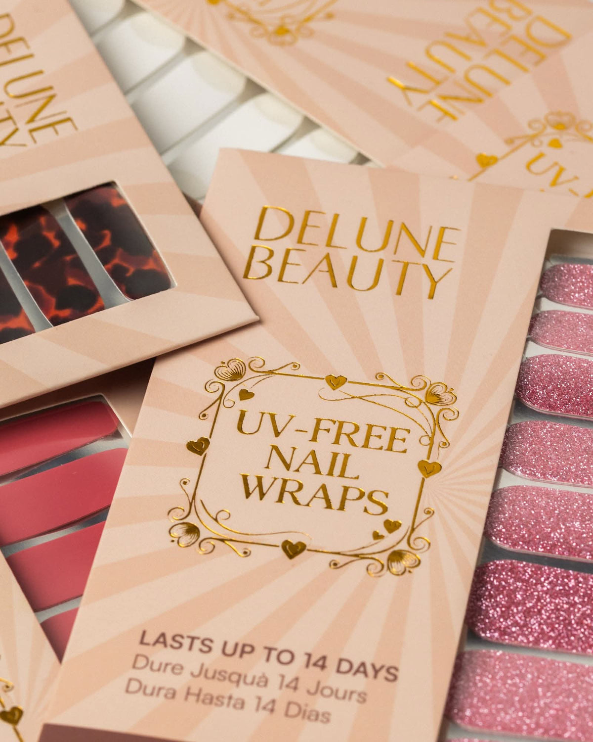 Blush (Non-UV Nail Wraps): Delune Beauty UV-free nail wrap packaging, lasts up to 14 days, with tortoiseshell, red and pink glitter wraps