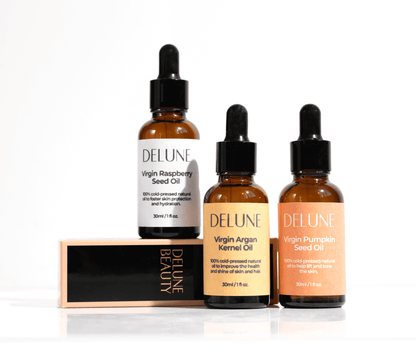 Delune Beauty oil collection featuring Virgin Raspberry, Argan, and Pumpkin Seed Oils, 100% cold-pressed for skin and hair care.