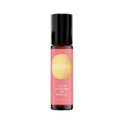 Neroli Essential Oil Roll-On with uplifting citrus-floral scent, 10ml bottle for stress relief and relaxation.