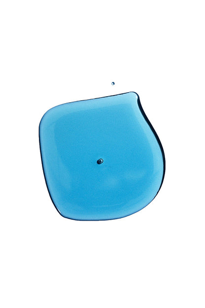 Blue drop of Delune Plum & Blue Tansy Face Oil with a dewy texture, rich in vitamins and Omegas, promoting healthy skin glow.