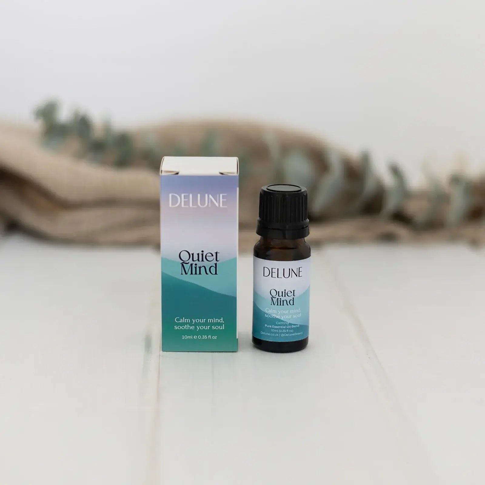 Quiet Mind Wellbeing Blend essential oil with sandalwood, frankincense, citrus, lavender for calming and focus.