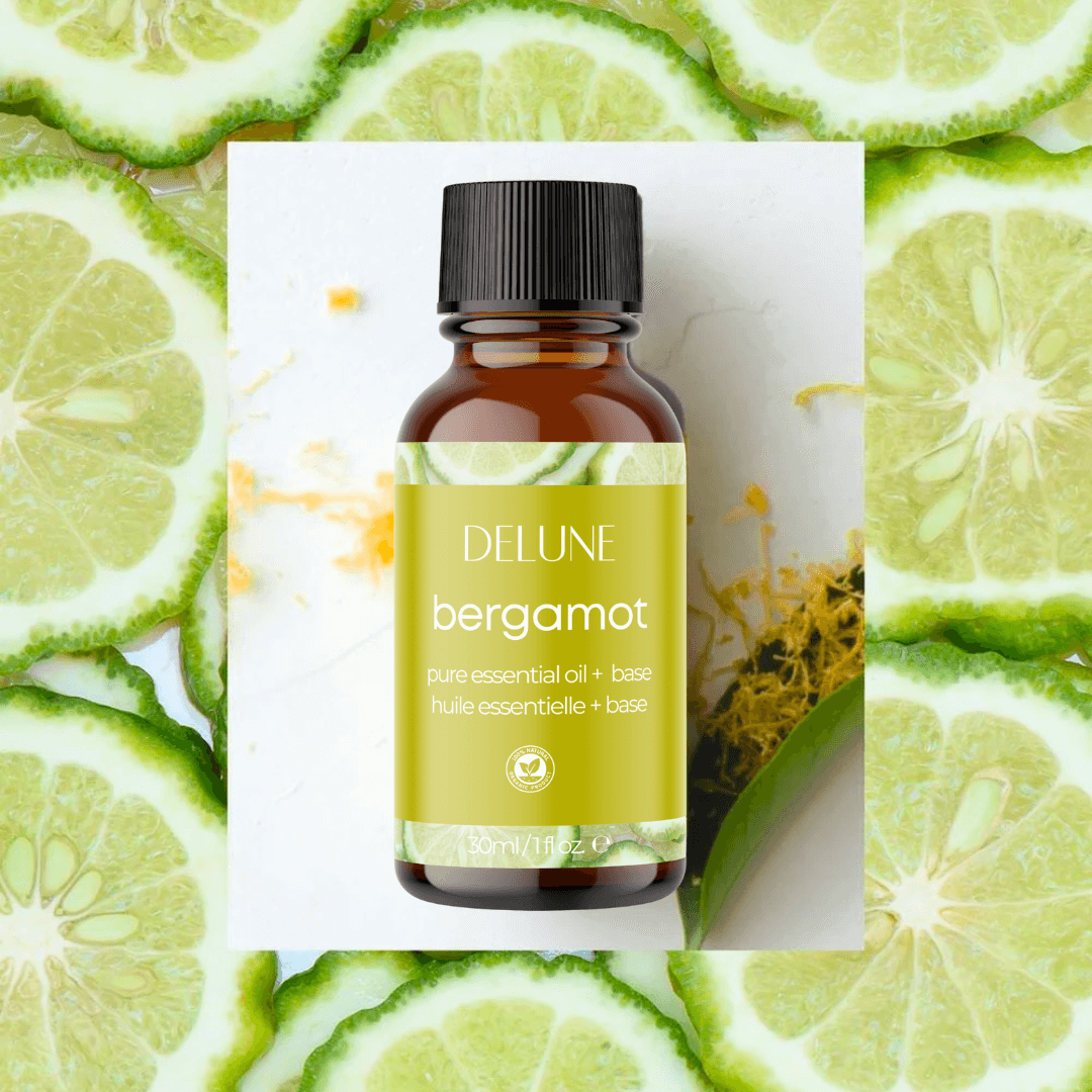 Bergamot essential oil bottle surrounded by fresh citrus slices, ideal for creating uplifting and refreshing aromatic blends.