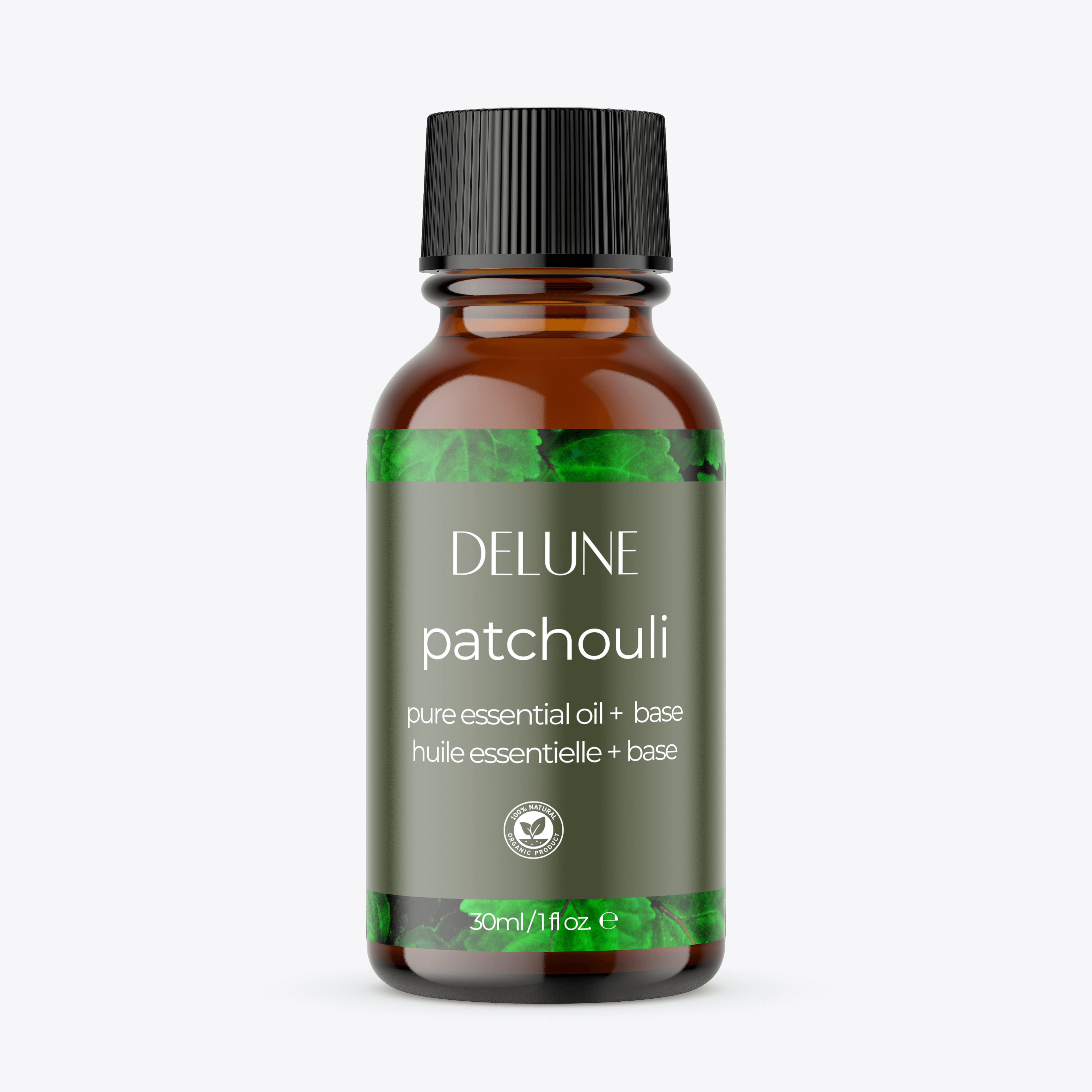 Patchouli Essential Oil bottle with lush green leaves background, showcasing calming woodsy aroma perfect for body and bath relaxation.